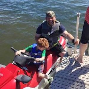 Father and son jetskiing at Red Door Resort on Lake Mille Lacs