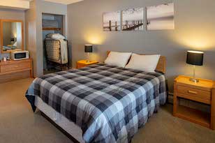 Queen bed motel rooms at Red Door Resort