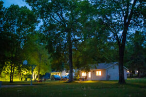 Vacation cabin with lights on in the evening. 